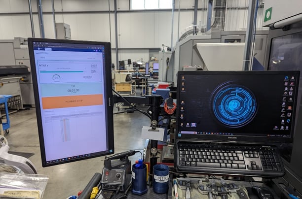 JITbase displayed on a computer next to the machine