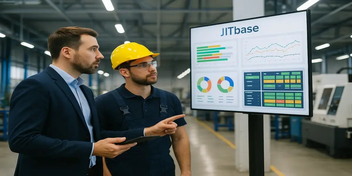 Supervisor and machine operator reviewing a real-time JITbase production dashboard on a large screen inside a CNC machining shop floor.